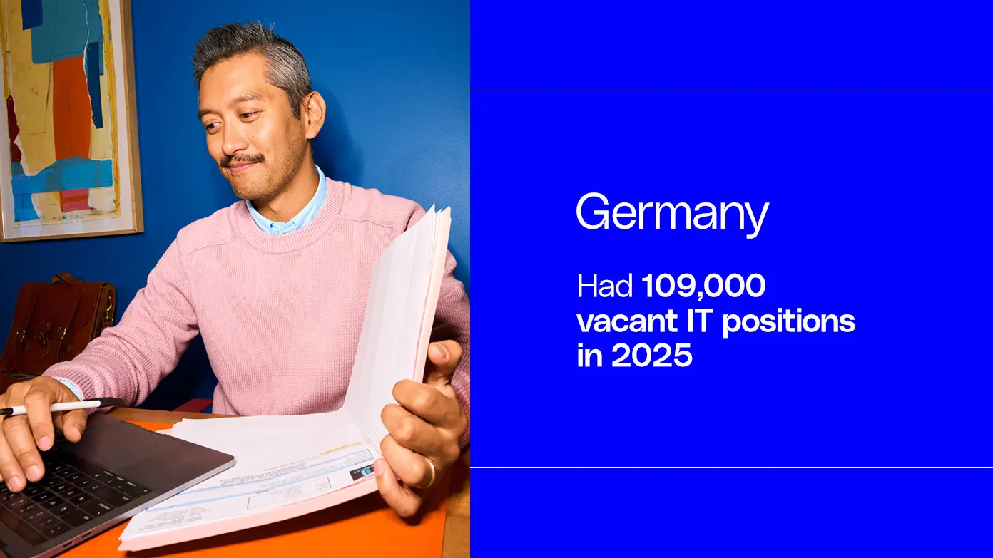 IT professional reviewing documents in Germany, where 109,000 IT positions remained vacant in 2025; a key insight into the global IT talent shortage.
