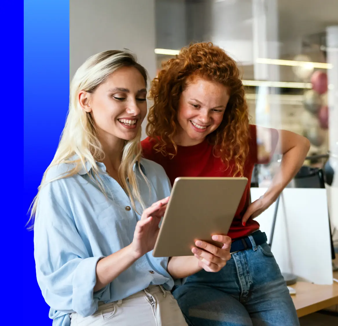 Two women looking at a tablet