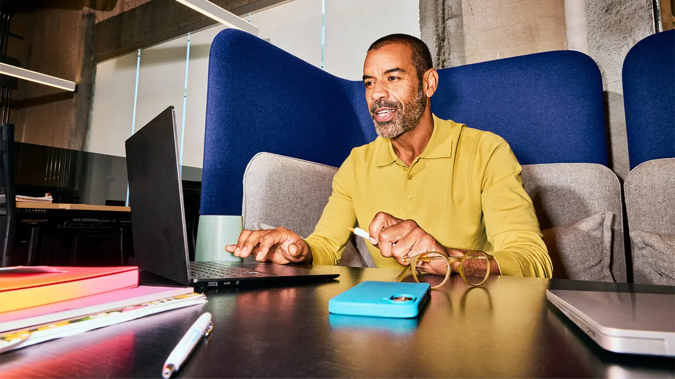 Woman working from home at dining table